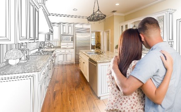 Couple in front of renovated kitchen